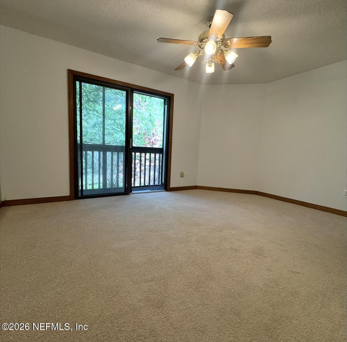 10800 Old St Augustine Road, Unit 204 Jacksonville, FL 32257 - Photo 24 of 31 Primary bedroom with balcony
