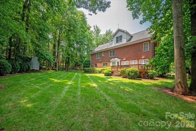 a view of backyard with a garden and entertaining space