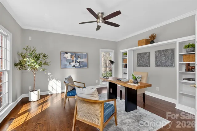 a living room with furniture a rug and a table