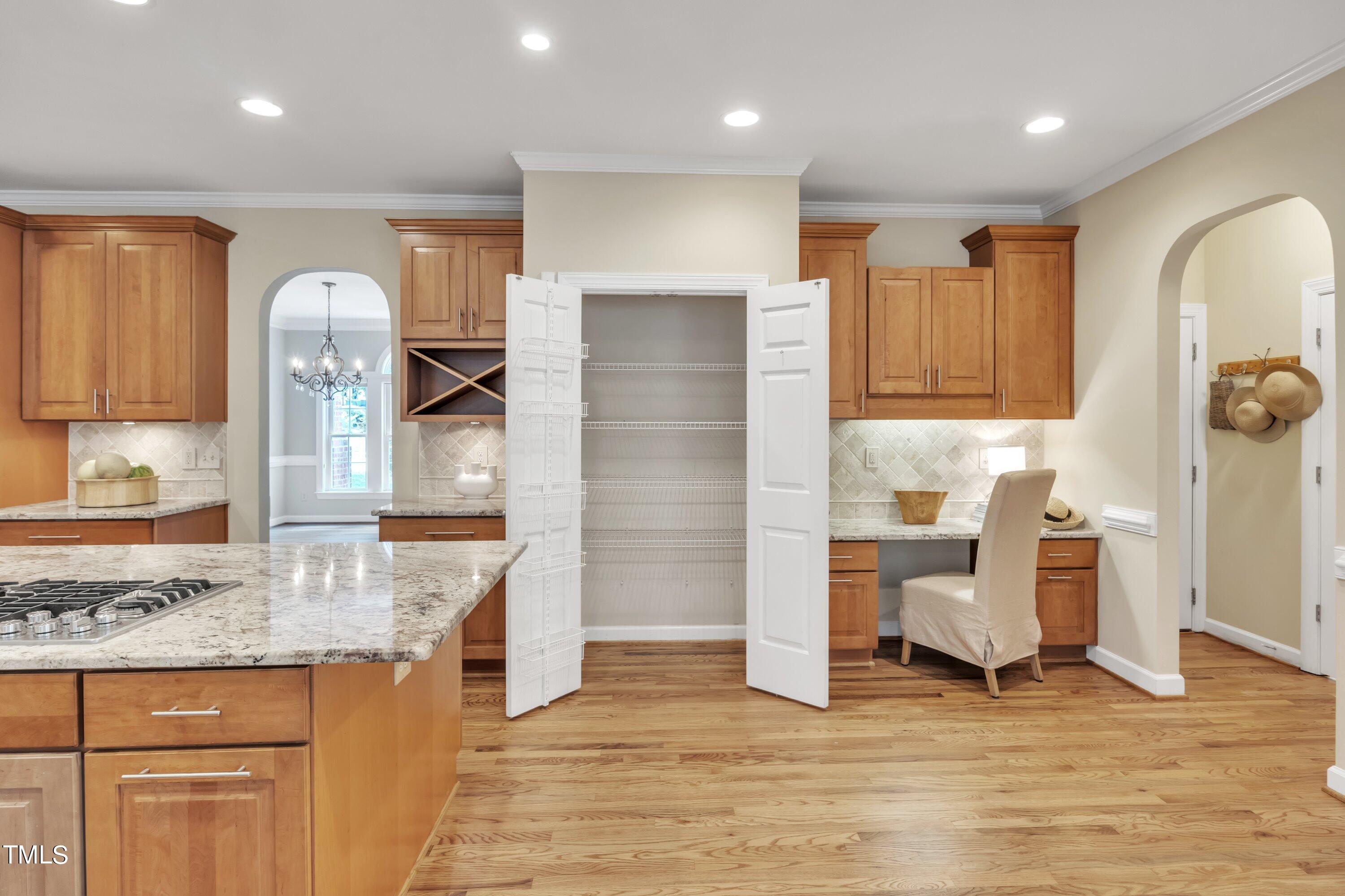 12208 Jasmine Cove Way Raleigh, NC 27614 - Photo 11 of 57 a kitchen with stainless steel appliances granite countertop a refrigerator and cabinets