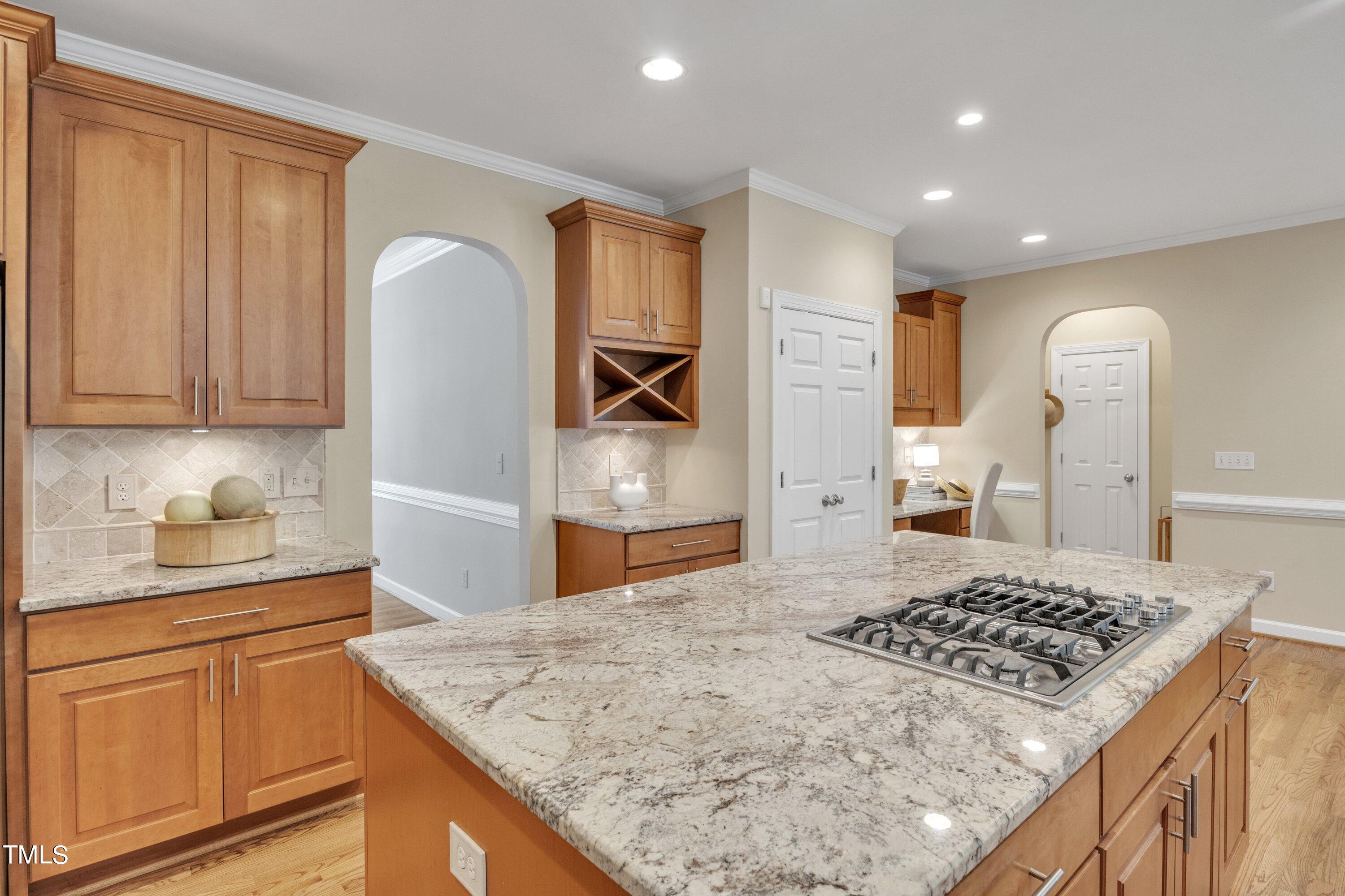 12208 Jasmine Cove Way Raleigh, NC 27614 - Photo 17 of 57 a kitchen with stainless steel appliances granite countertop a sink stove and refrigerator