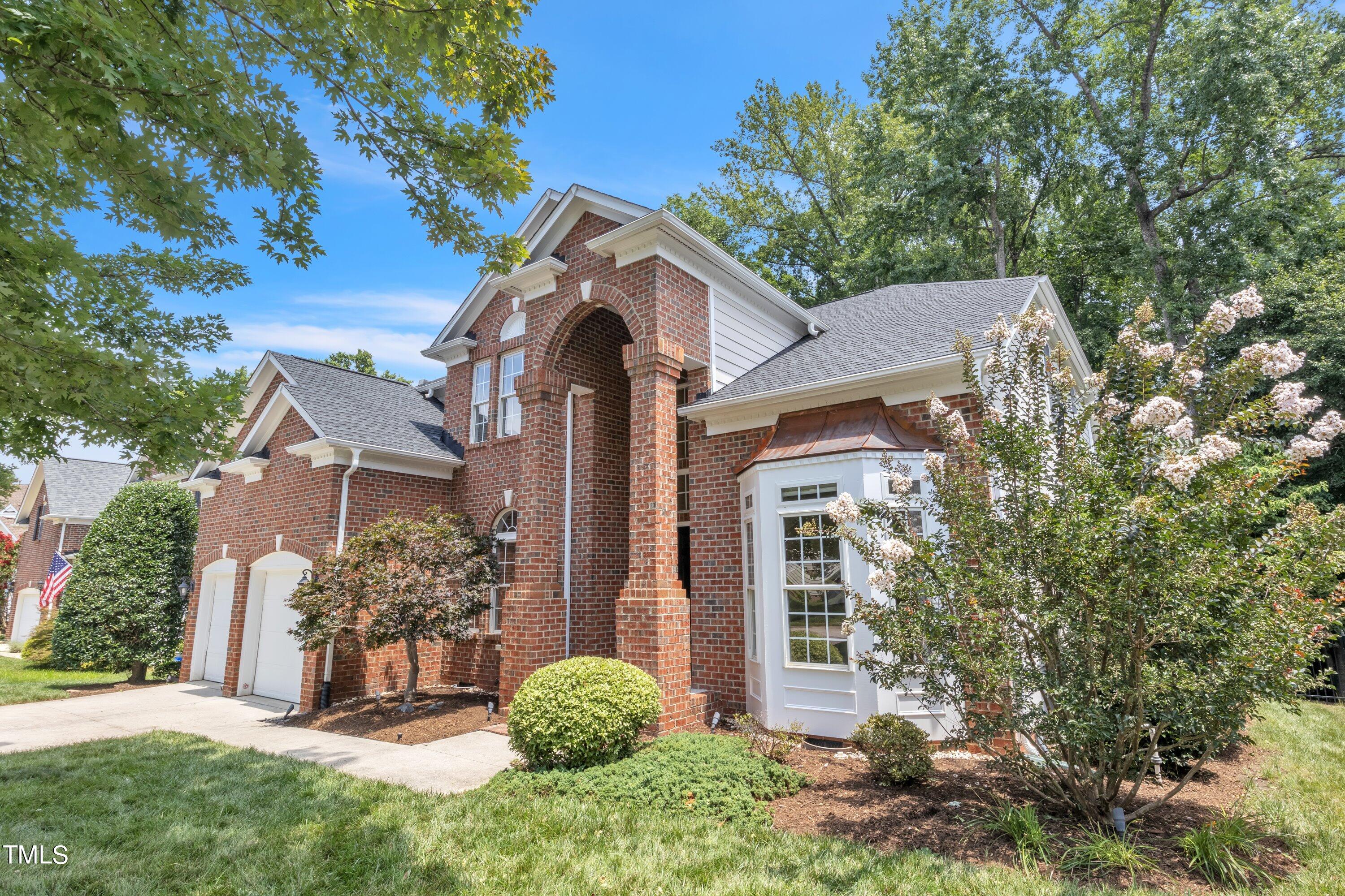 12208 Jasmine Cove Way Raleigh, NC 27614 - Photo 2 of 57 a view of a house with a yard and plants