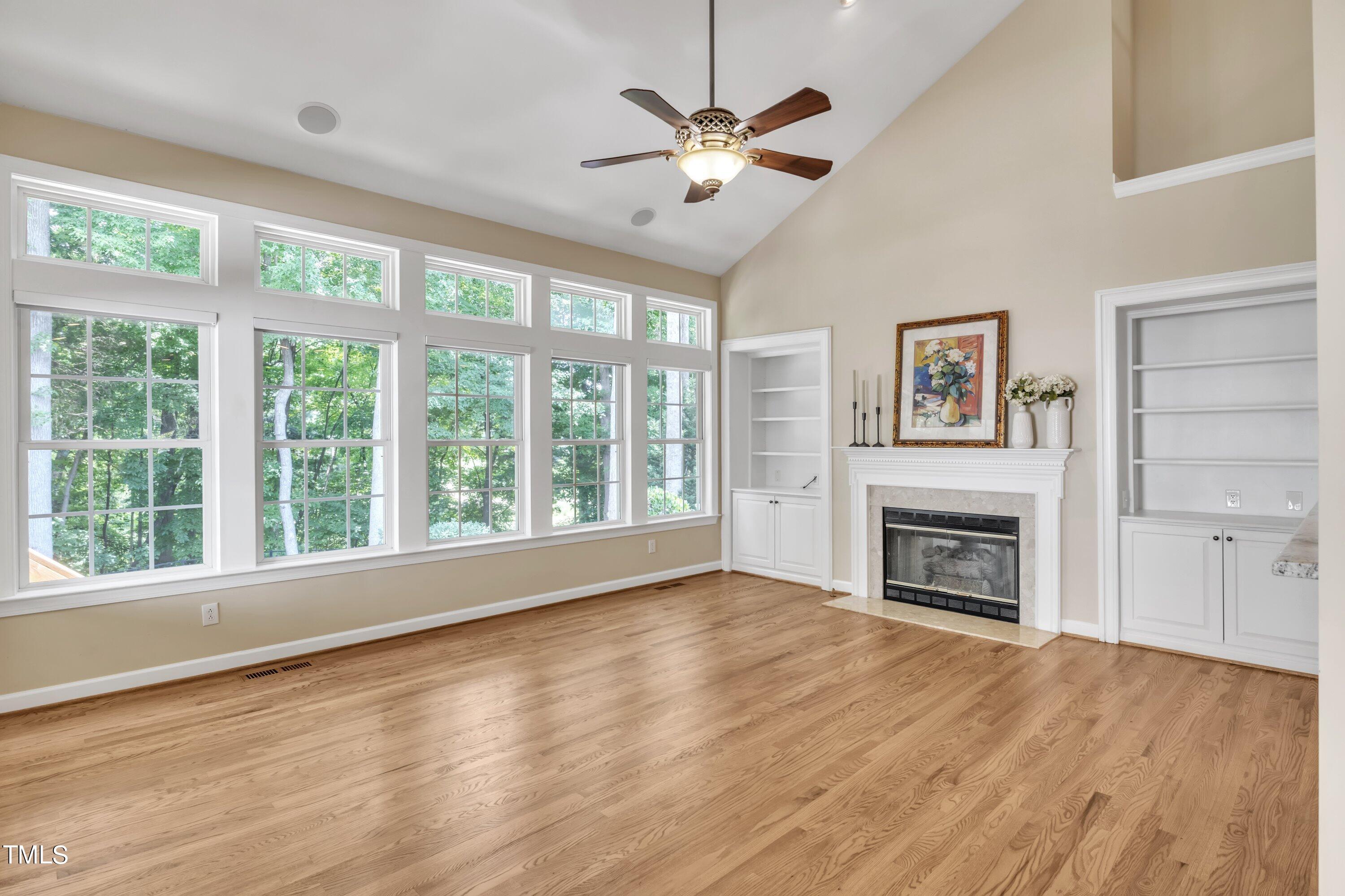 12208 Jasmine Cove Way Raleigh, NC 27614 - Photo 22 of 57 a view of an empty room with a window and wooden floor
