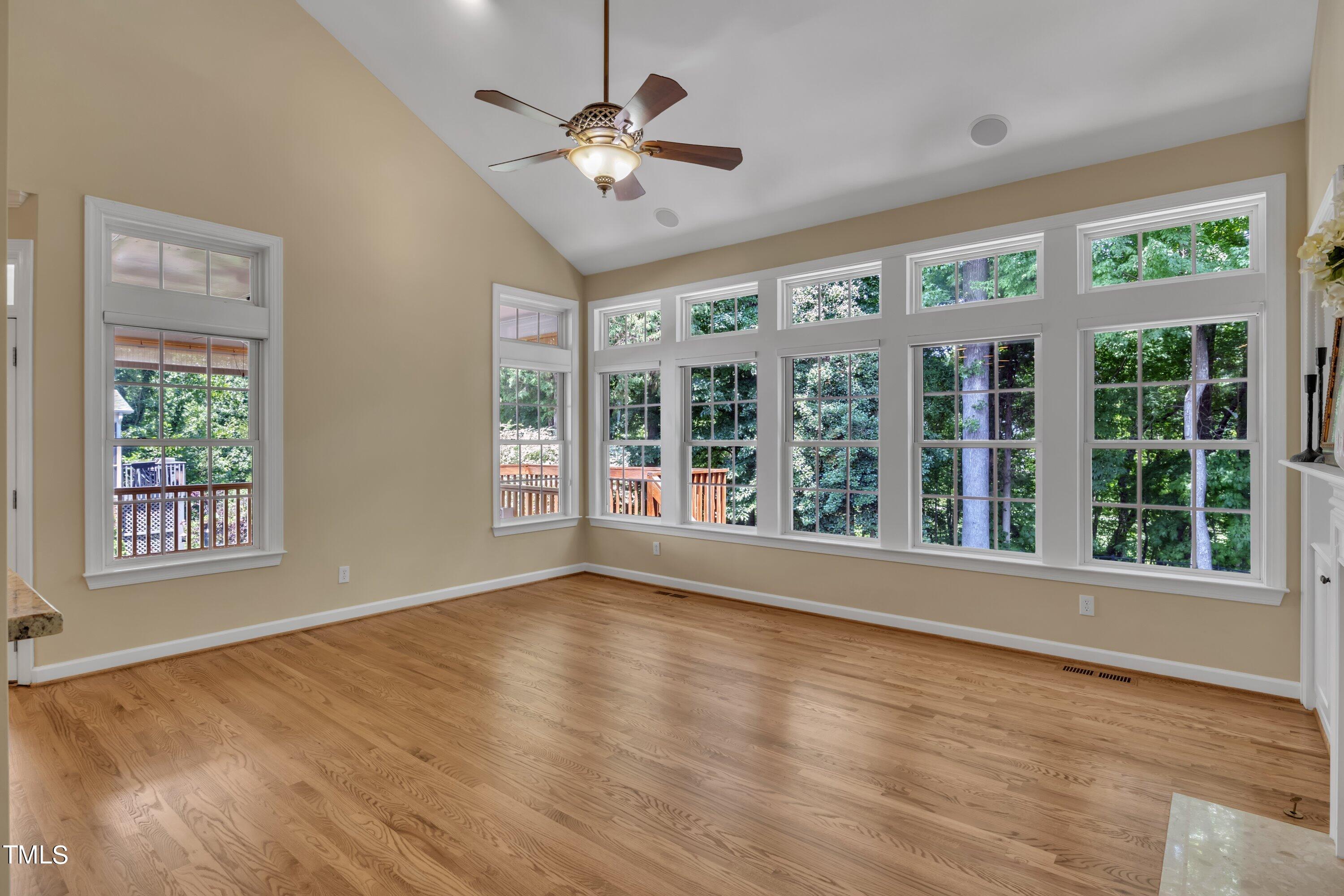 12208 Jasmine Cove Way Raleigh, NC 27614 - Photo 26 of 57 a view of an empty room with a window and wooden floor