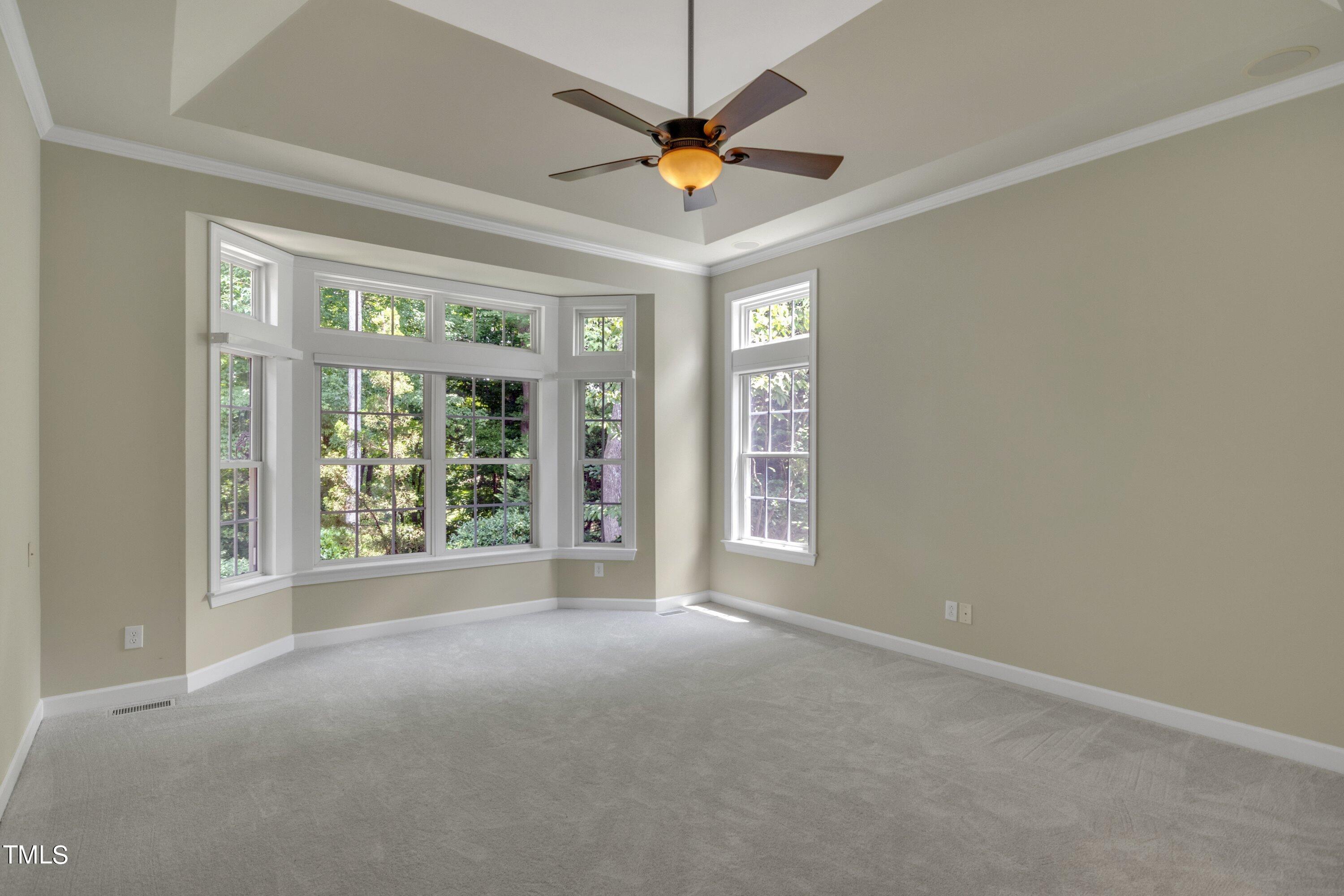 12208 Jasmine Cove Way Raleigh, NC 27614 - Photo 28 of 57 a view of a livingroom with a ceiling fan and window