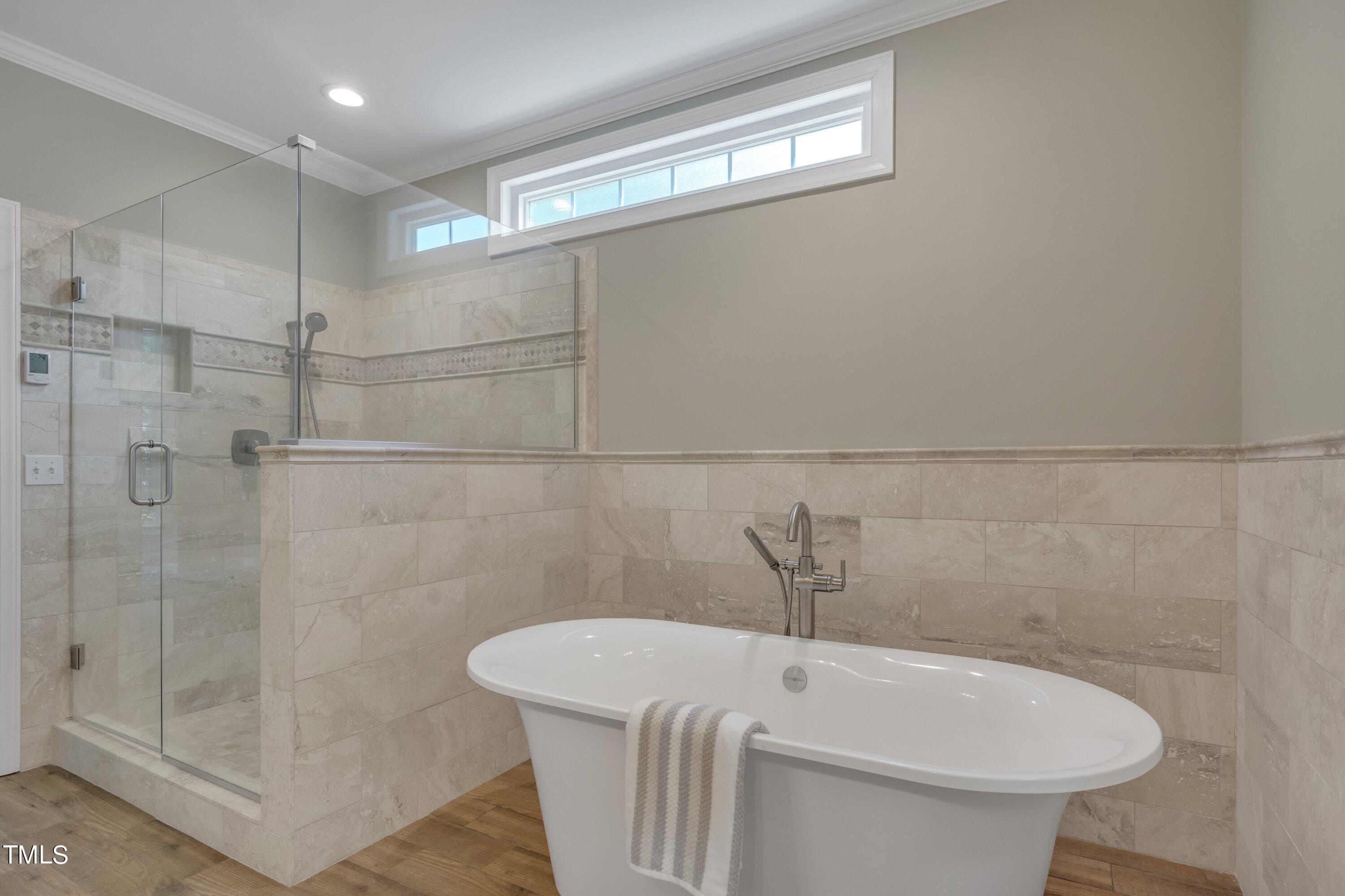 12208 Jasmine Cove Way Raleigh, NC 27614 - Photo 33 of 57 a bathroom with a sink a toilet and shower
