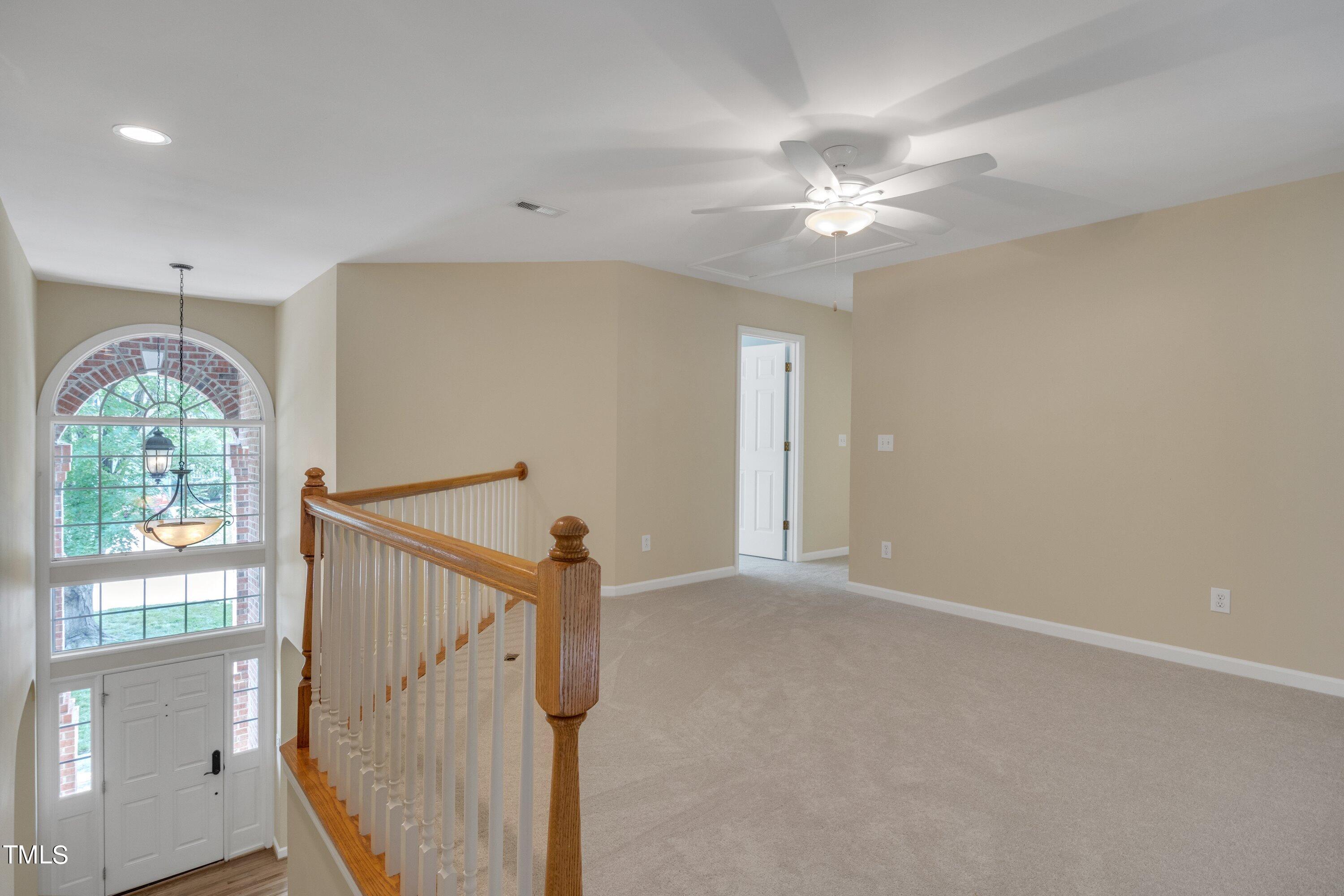 12208 Jasmine Cove Way Raleigh, NC 27614 - Photo 35 of 57 wooden floor in an empty room with a window