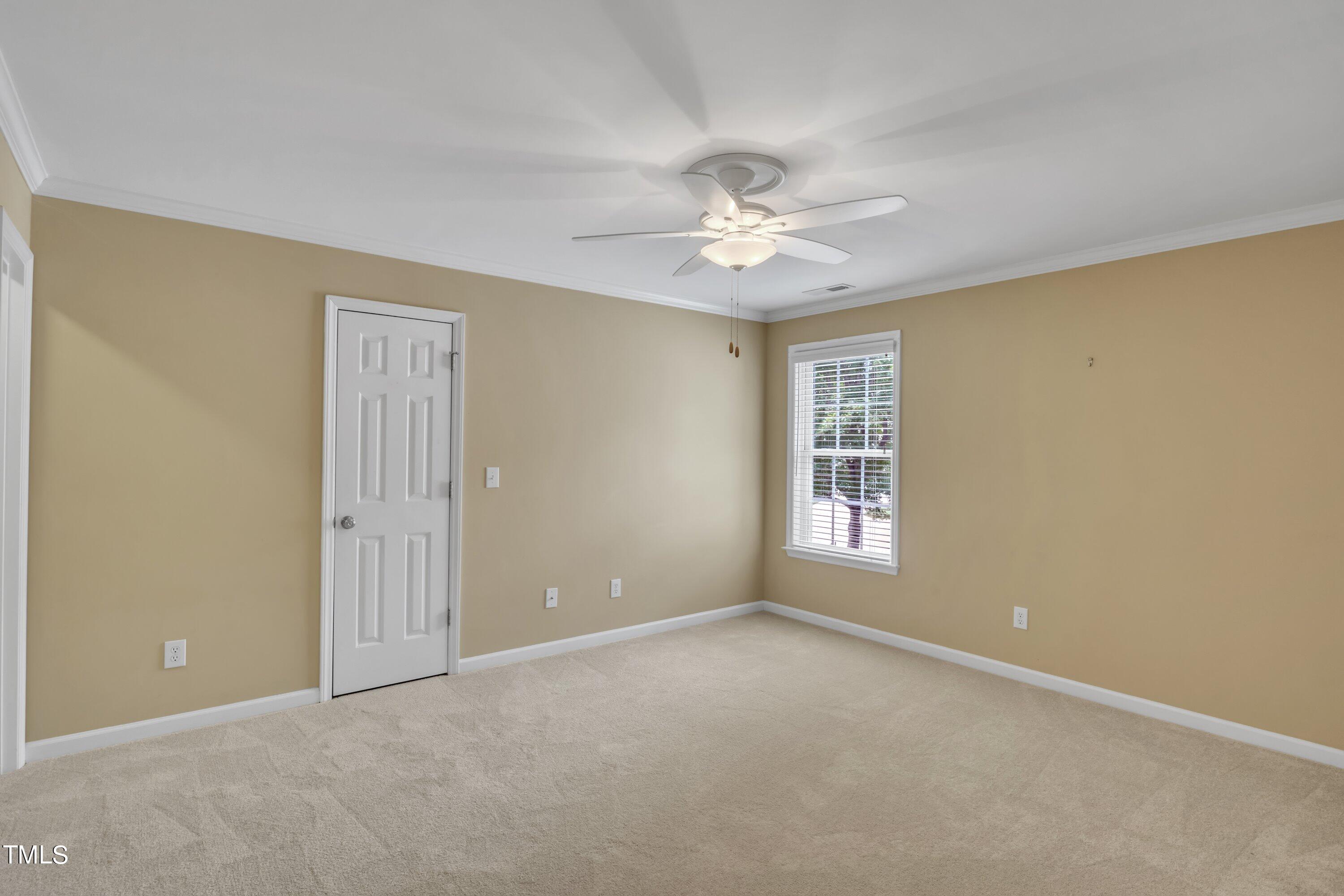 12208 Jasmine Cove Way Raleigh, NC 27614 - Photo 41 of 57 a view of an empty room with a window