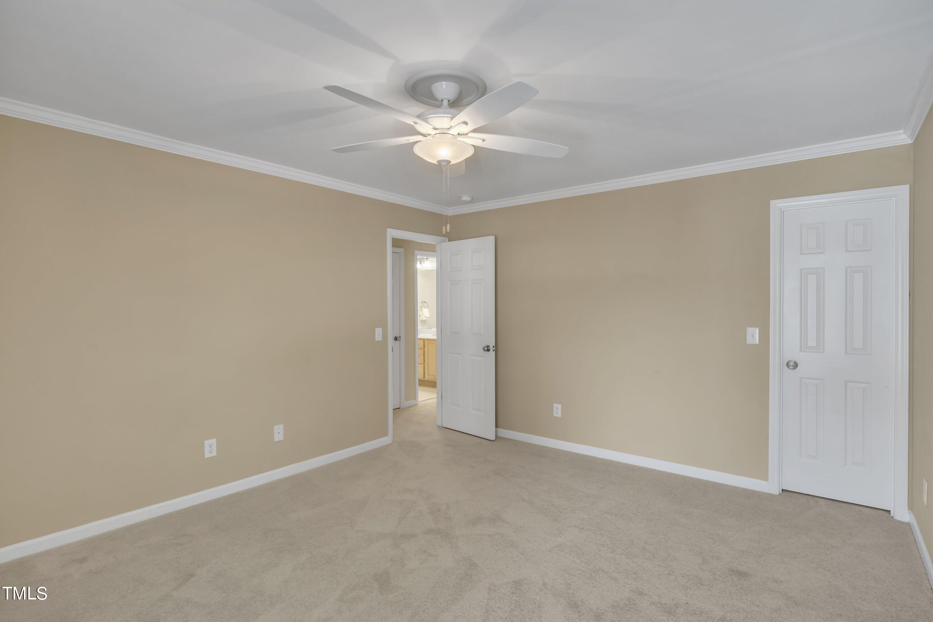 12208 Jasmine Cove Way Raleigh, NC 27614 - Photo 42 of 57 a view of an empty room with a window