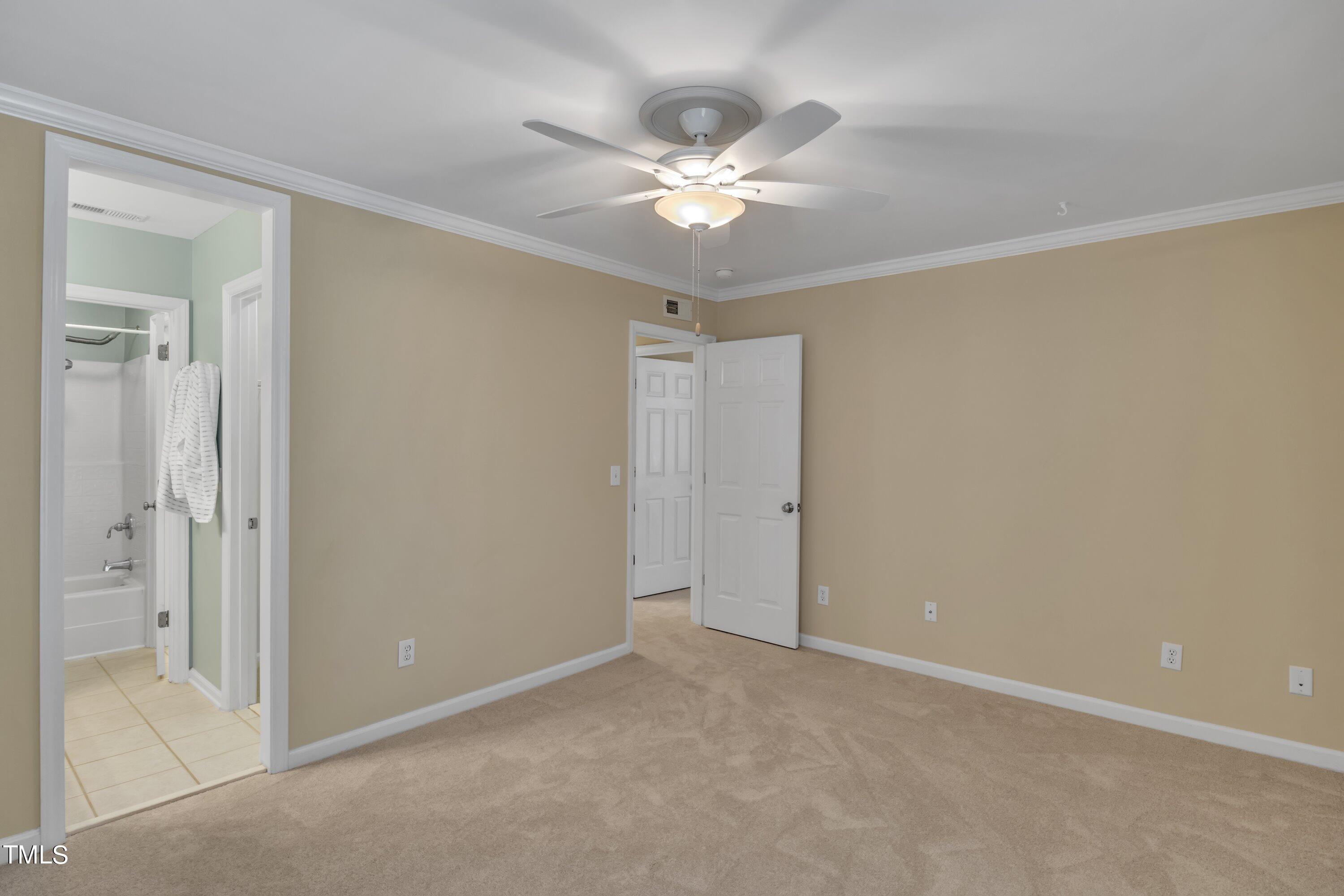 12208 Jasmine Cove Way Raleigh, NC 27614 - Photo 43 of 57 a view of an empty room and chandelier fan