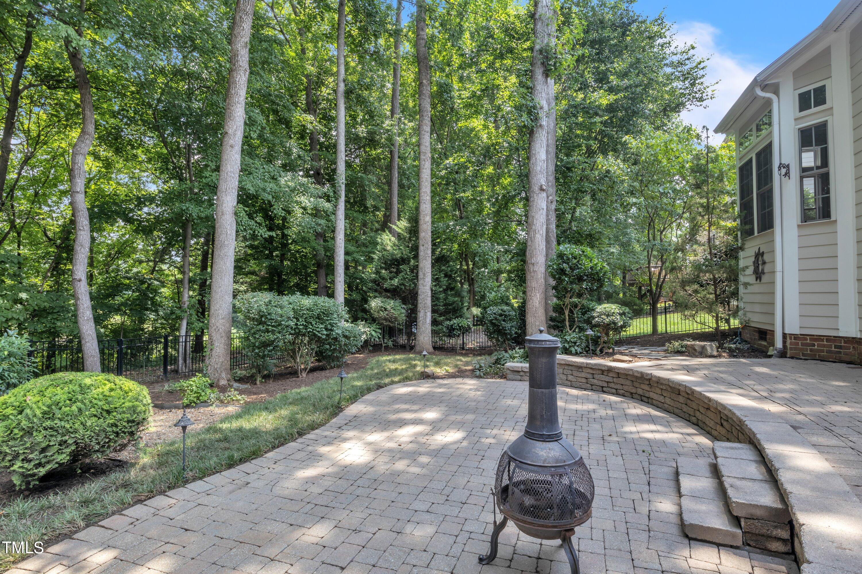 12208 Jasmine Cove Way Raleigh, NC 27614 - Photo 45 of 57 a wooden bench sitting in the middle of a yard