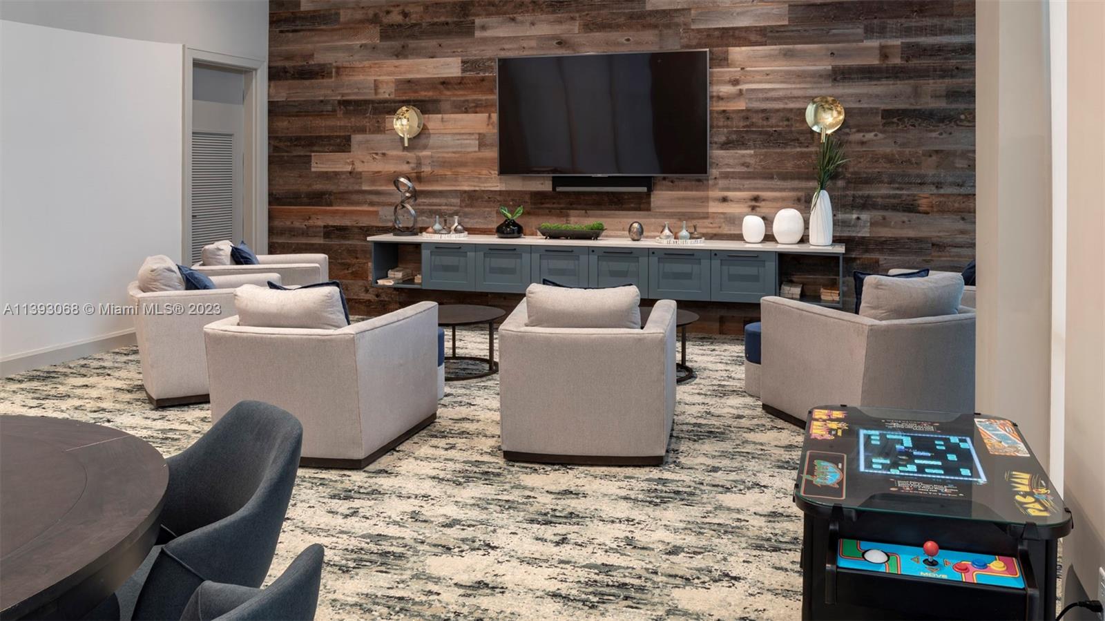 2701 Biscayne Boulevard, Unit 6217 Miami, FL 33137 - Photo 38 of 45 a living room with furniture a flat screen tv and a fireplace