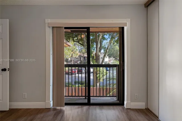 a view of entryway with wooden floor