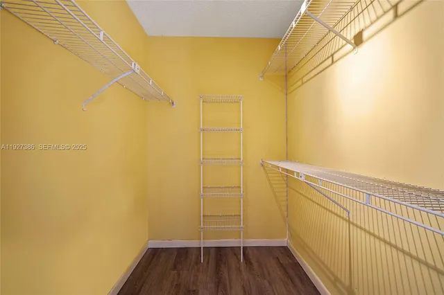 a bathroom with a wooden floor