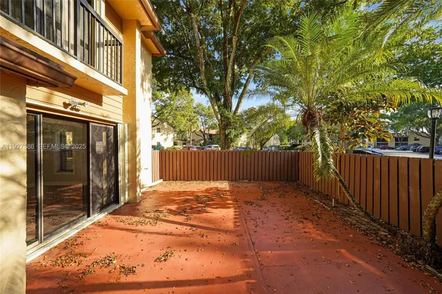a view of backyard with tub