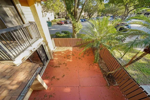 a view of balcony with wooden floor