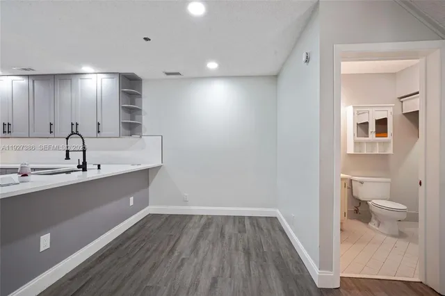 a view of bathroom with a sink and a toilet