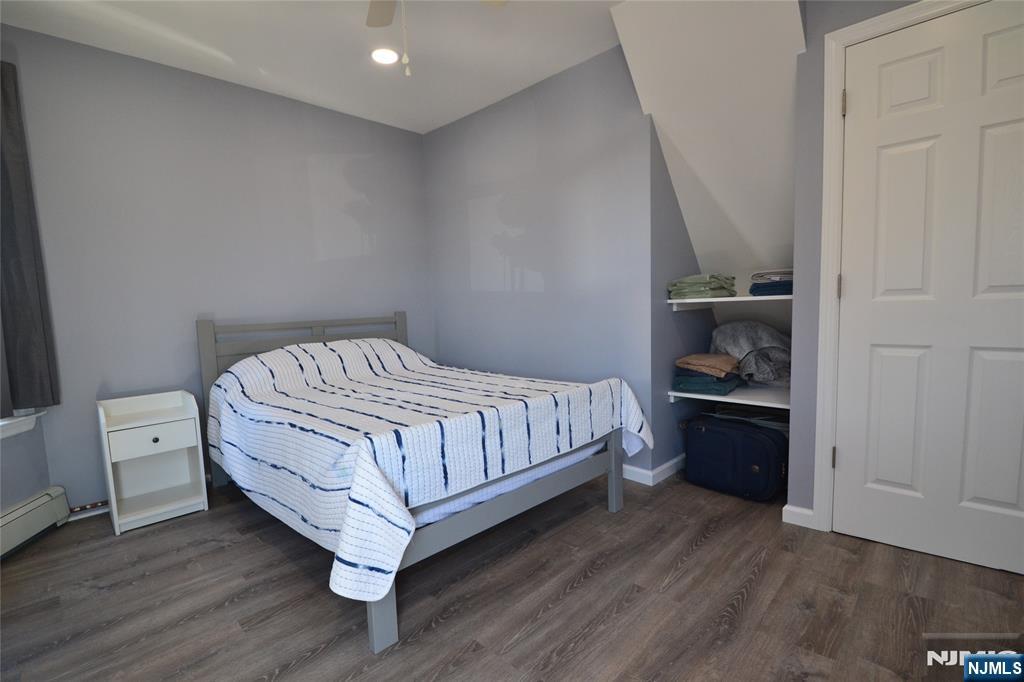 655 Chestnut Street Kearny, NJ 07032 - Photo 18 of 31 a bedroom with a bed and a window