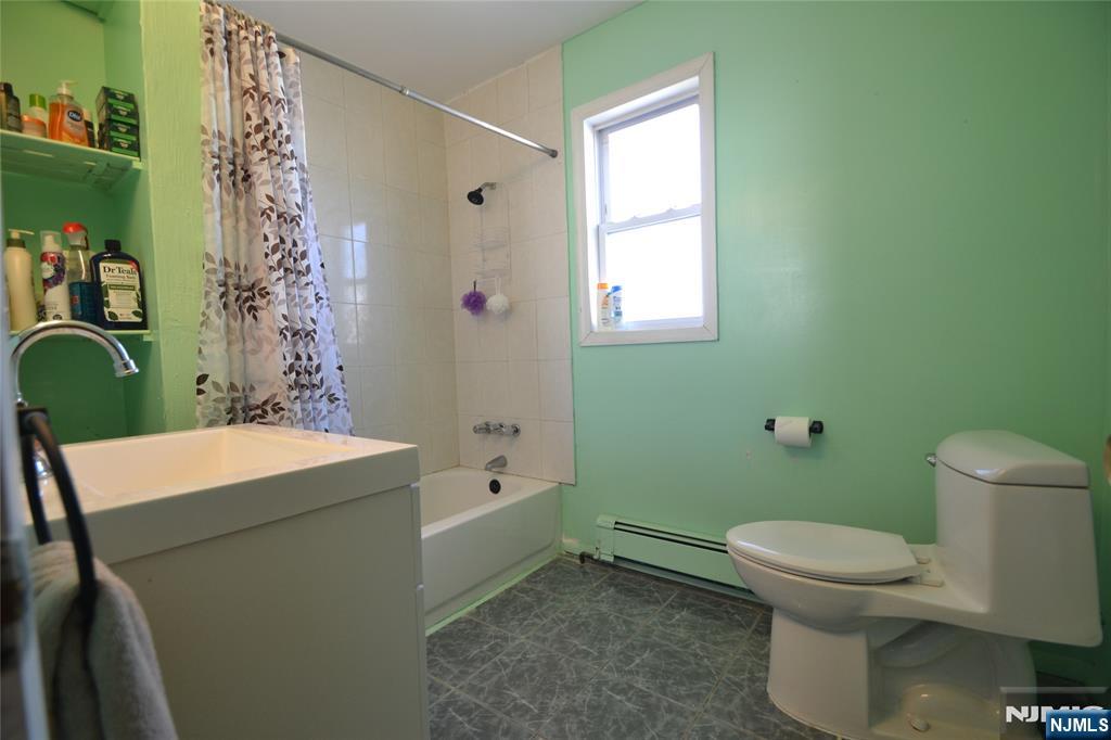 655 Chestnut Street Kearny, NJ 07032 - Photo 19 of 31 a bathroom with a sink toilet and shower