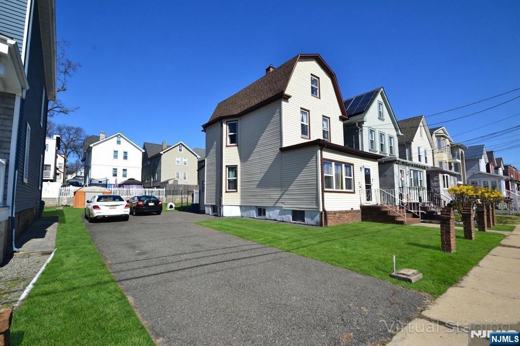 655 Chestnut Street Kearny, NJ 07032 - Photo 2 of 31 a view of a house with a back yard