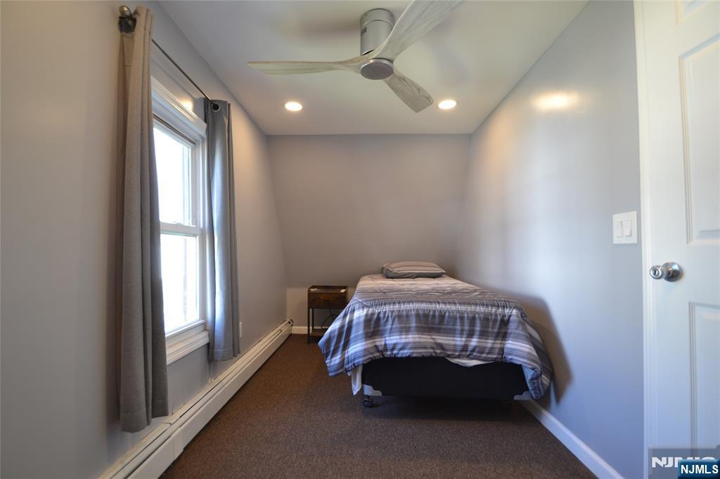 655 Chestnut Street Kearny, NJ 07032 - Photo 23 of 31 a bedroom with a bed and a window