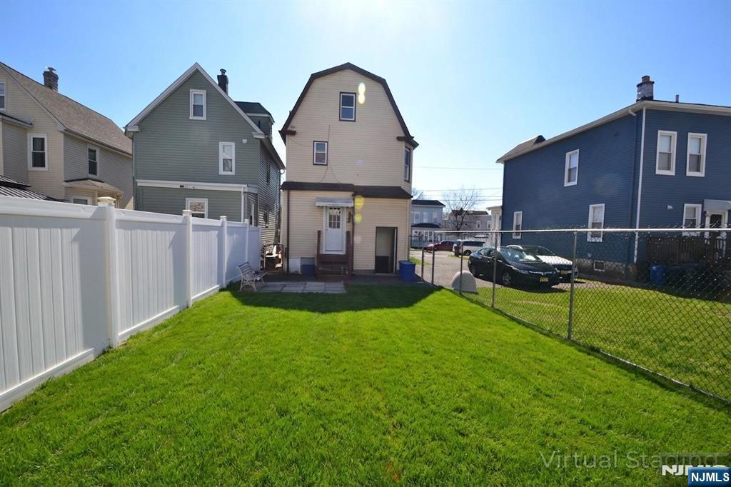 655 Chestnut Street Kearny, NJ 07032 - Photo 3 of 31 a view of a house with backyard and porch