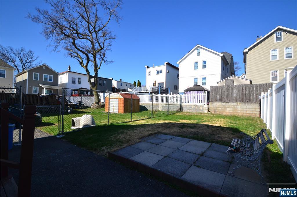 655 Chestnut Street Kearny, NJ 07032 - Photo 4 of 31 a view of an house with backyard and porch