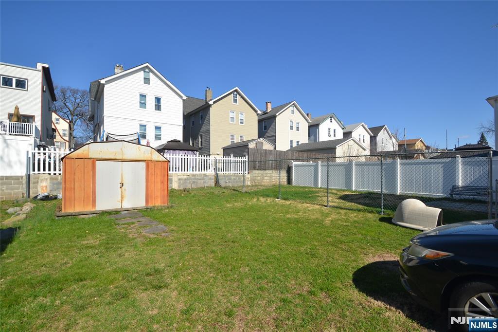 655 Chestnut Street Kearny, NJ 07032 - Photo 6 of 31 a front view of a house with garden and sitting area
