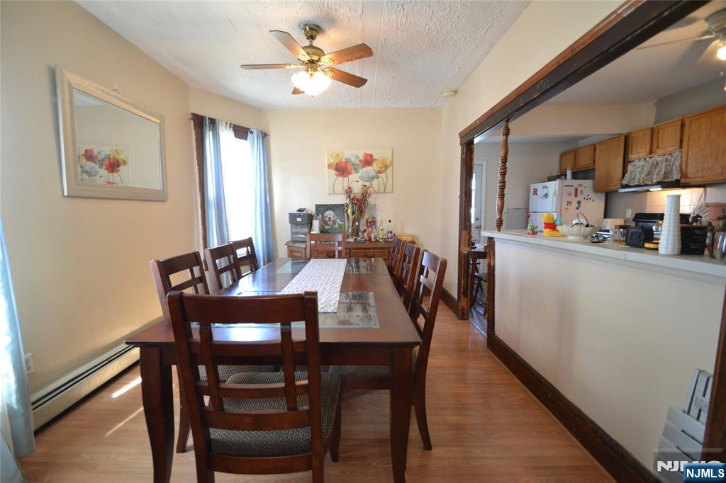 655 Chestnut Street Kearny, NJ 07032 - Photo 10 of 31 a view of a dining room with furniture and wooden floor