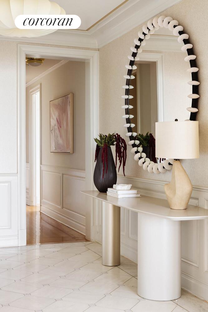 15 Central Park West, Unit 27D Manhattan, NY 10023 - Photo 17 of 30 a bathroom with a sink and mirror