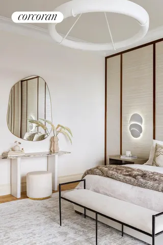 a living room with furniture and a table with bookshelf