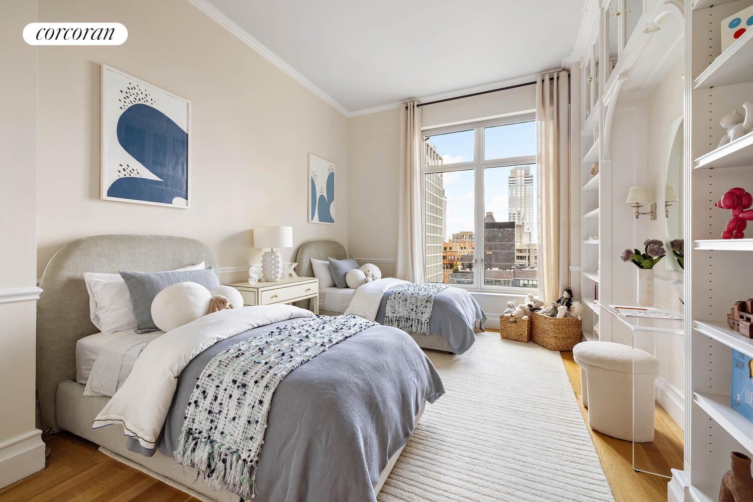 15 Central Park West, Unit 27D Manhattan, NY 10023 - Photo 24 of 30 a bedroom with two beds and a large mirror next to a window