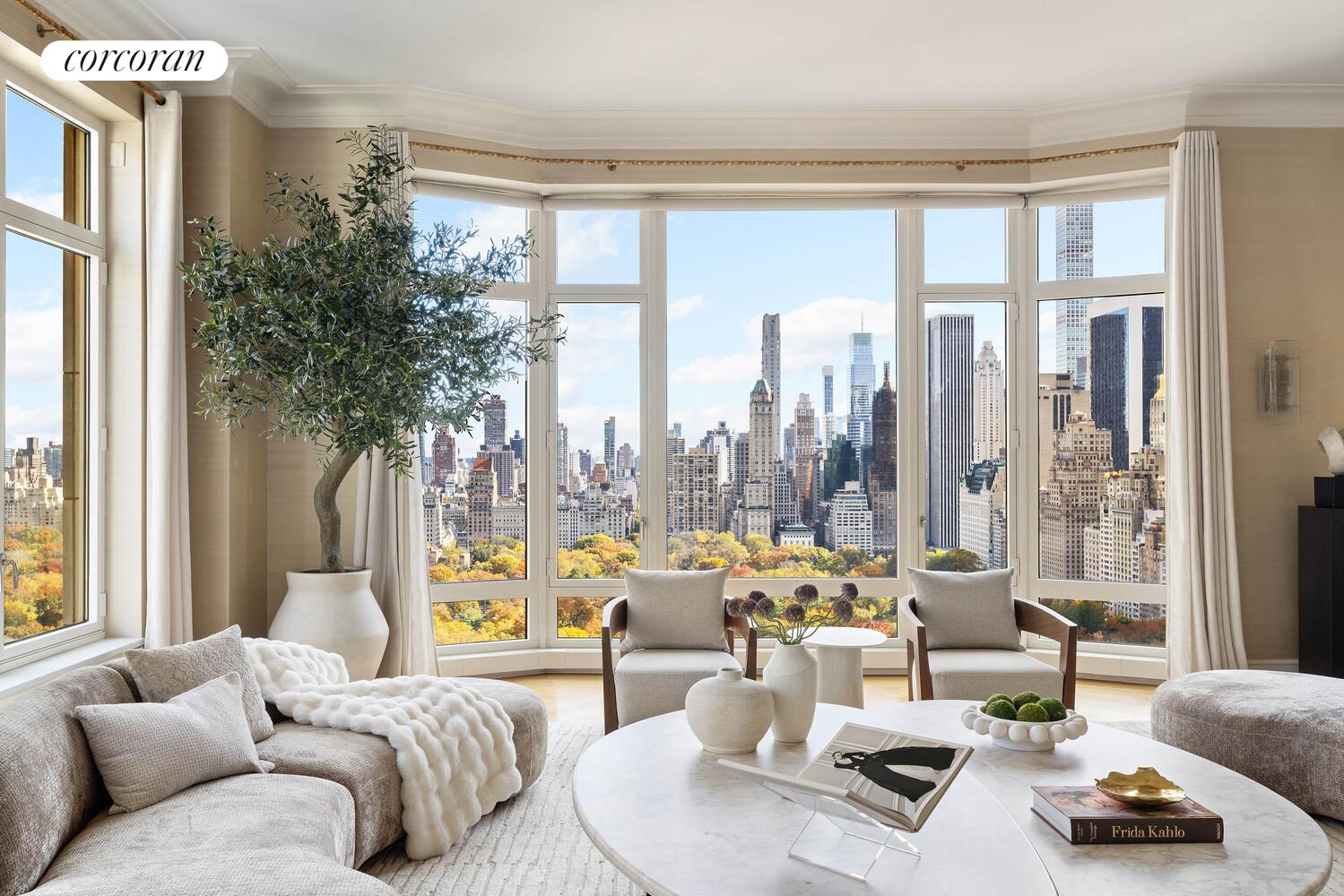 15 Central Park West, Unit 27D Manhattan, NY 10023 - Photo 2 of 30 a living room with furniture and a large window