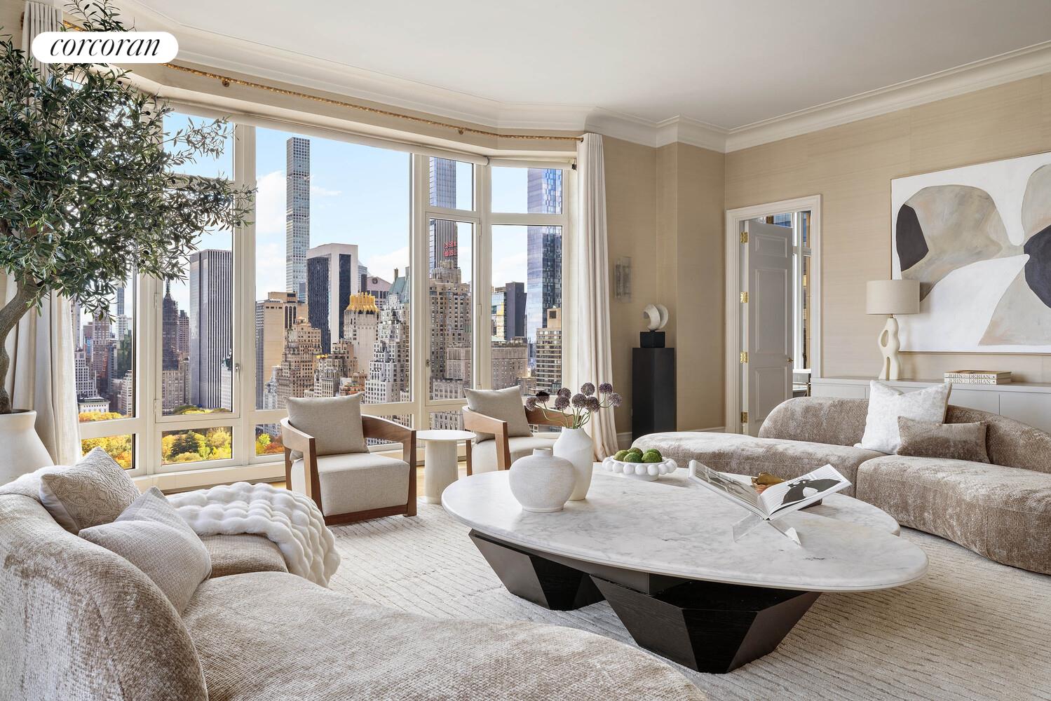 15 Central Park West, Unit 27D Manhattan, NY 10023 - Photo 3 of 30 a living room with furniture and a large window