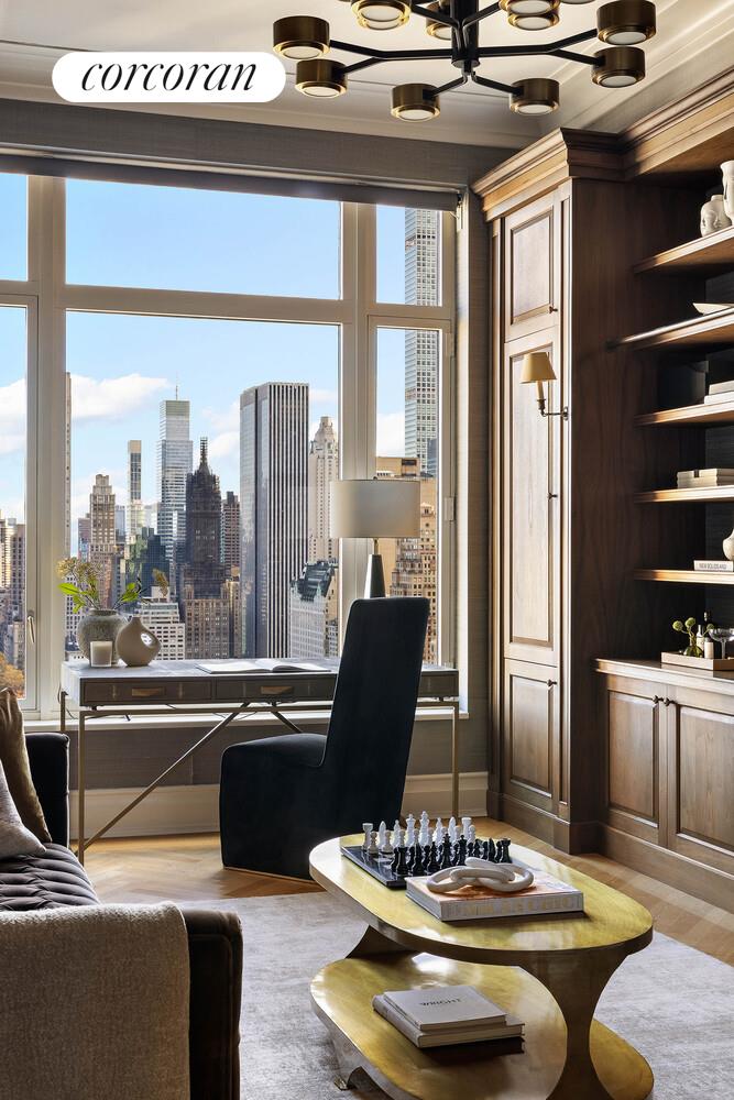 15 Central Park West, Unit 27D Manhattan, NY 10023 - Photo 9 of 30 a view of a dining room with furniture window and wooden floor