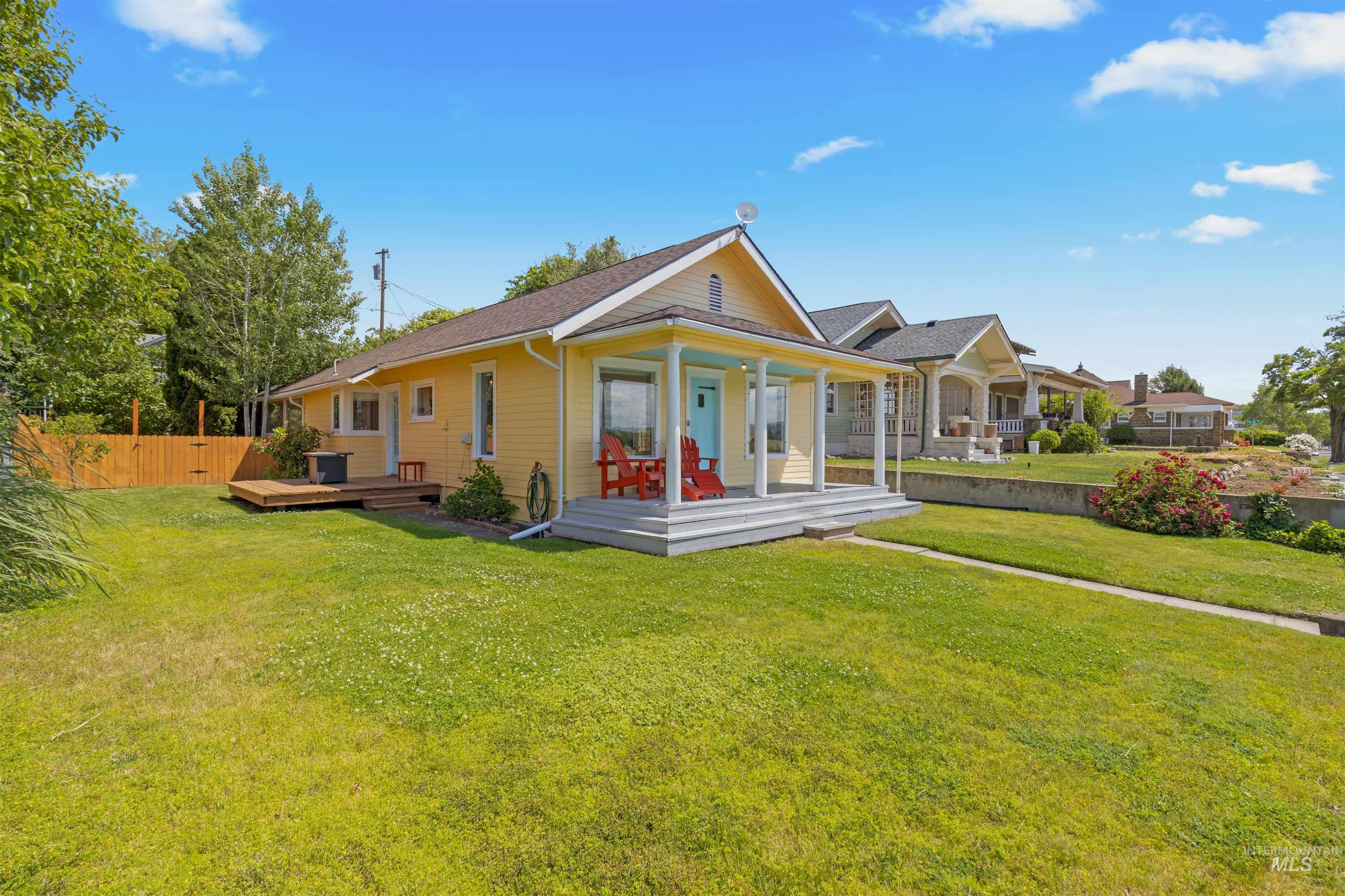 619 Prospect Avenue Lewiston, ID 83501 - Photo 26 of 37 Charming home featuring yellow siding, a covered porch with white columns, and a bright blue front door