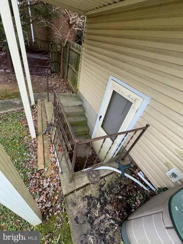 a room with wooden floor and furniture