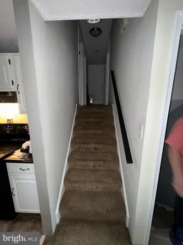 a bedroom with a bed and a mirror