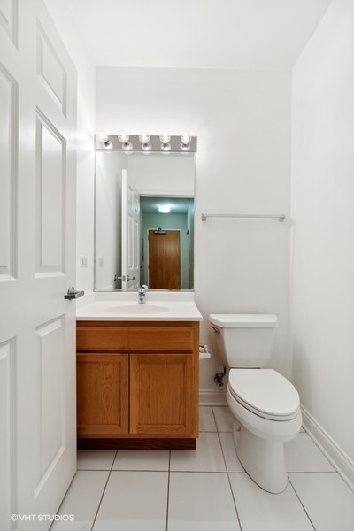 8 West Monroe Street, Unit 500 Chicago, IL 60603 - Photo 11 of 14 a bathroom with a toilet a sink and mirror