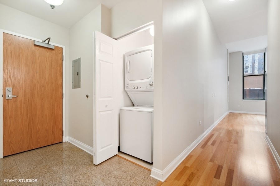 8 West Monroe Street, Unit 500 Chicago, IL 60603 - Photo 2 of 14 a view of a hallway and closet with wooden floor
