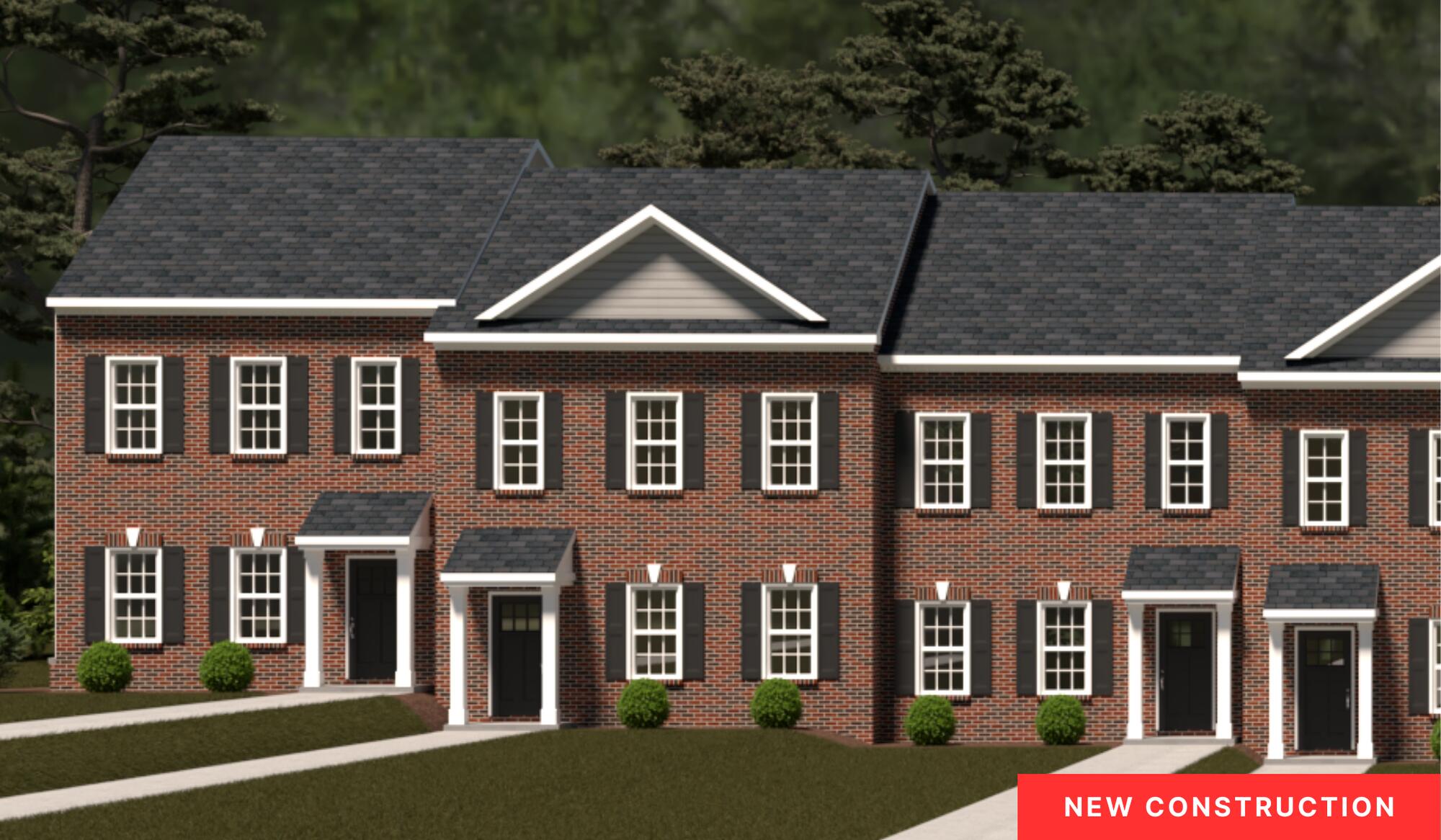 a front view of a residential apartment building with a yard