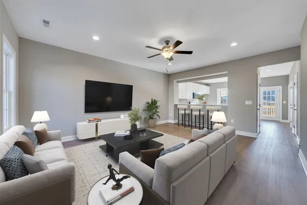 a living room with furniture and a flat screen tv