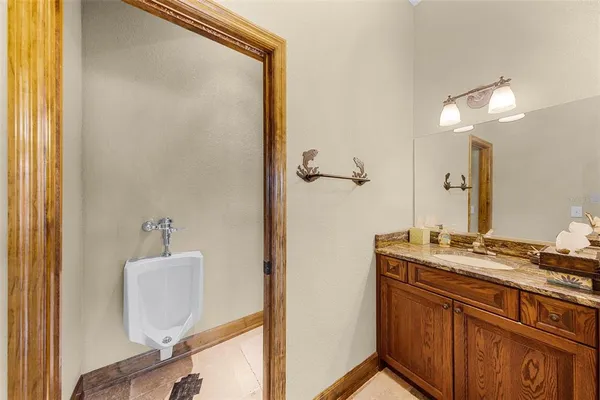 a bathroom with a sink a mirror and a shower