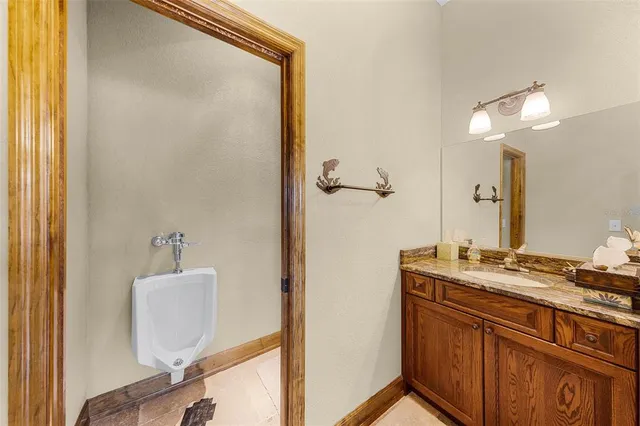 a bathroom with a sink a mirror and a shower