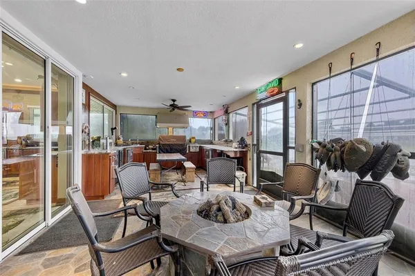 a living room with lots of furniture and a large window