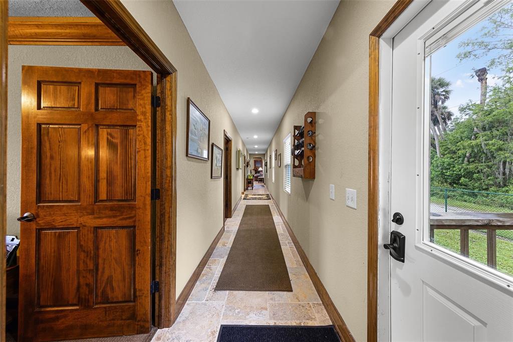 8270 Baxter Point North Mims, FL 32754 - Photo 18 of 50 a view of gallery with wooden floor and door