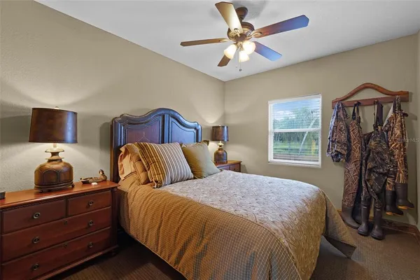 a bedroom with a bed and a tv