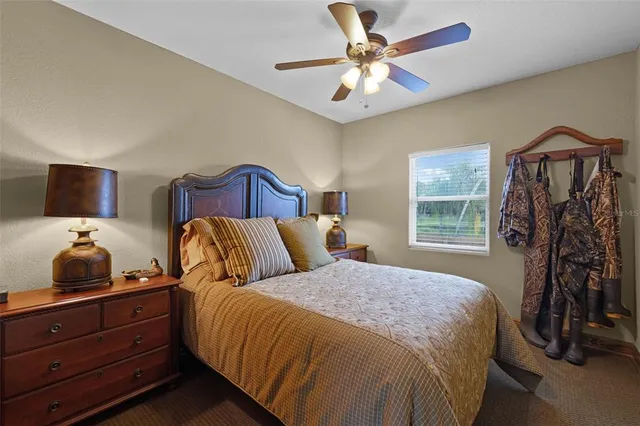 a bedroom with a bed and a tv