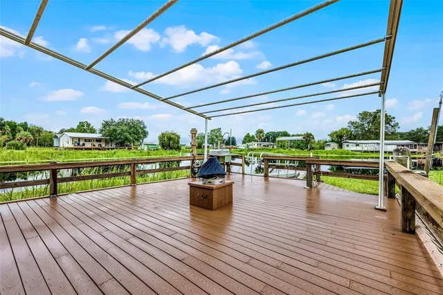 a view of a swimming pool with a deck