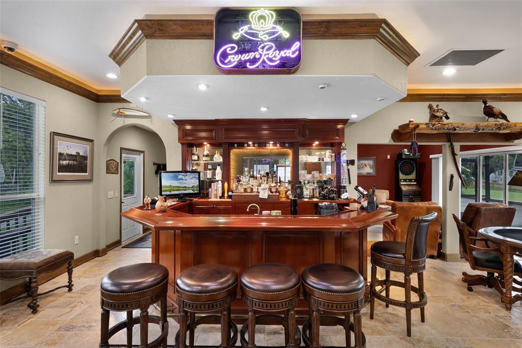 8270 Baxter Point North Mims, FL 32754 - Photo 3 of 50 a dining table with chairs and wooden floor